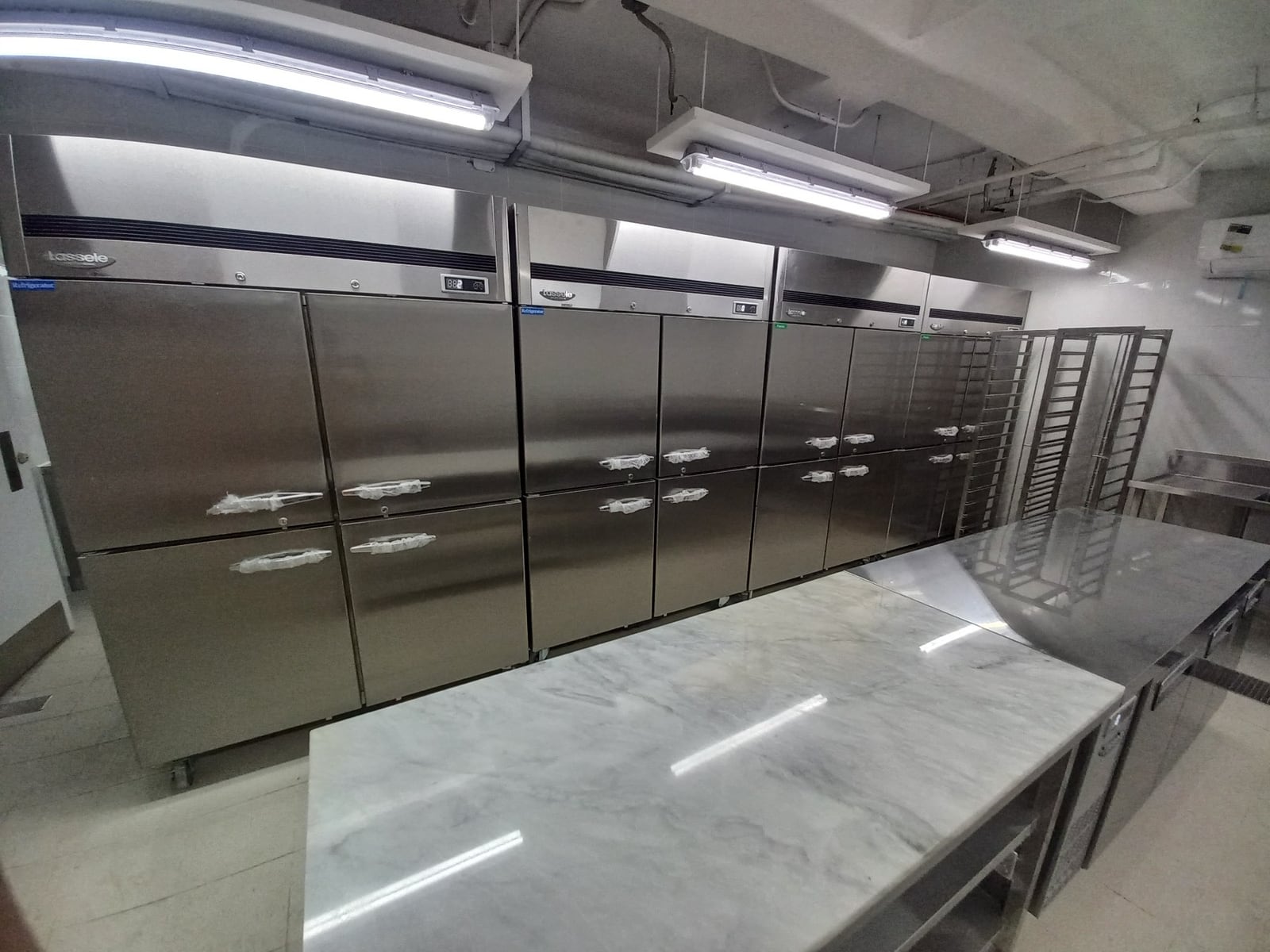 Balesin Pines Place kitchen with stainless refrigeration and preparation equipment
