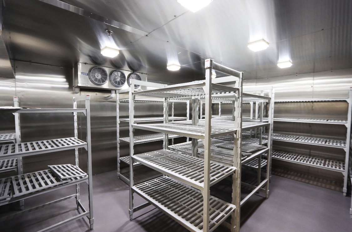 Commercial kitchen stainless storage racks and shelving.